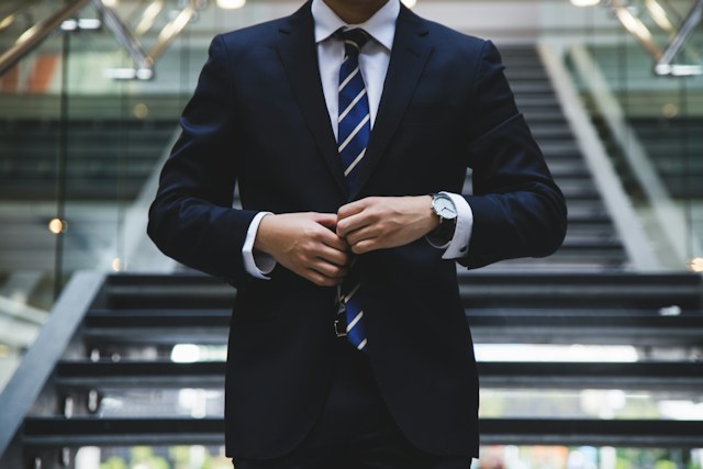 business man buttoning suit