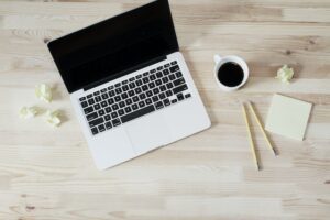 laptop, coffe, and pencil on desk